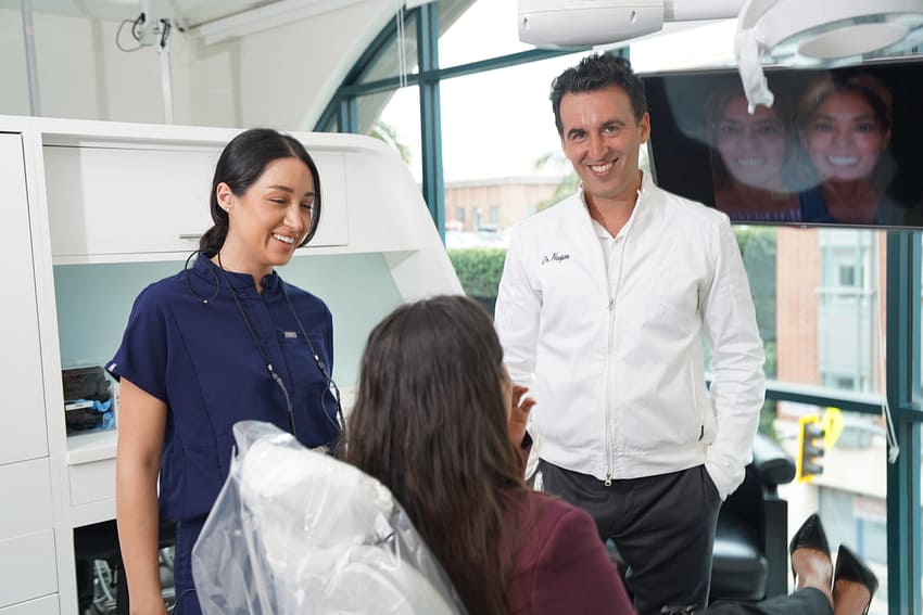 Photo of Dr. Daniel Naysan of Bedford Dental Group in Beverly Hills working with a patient.